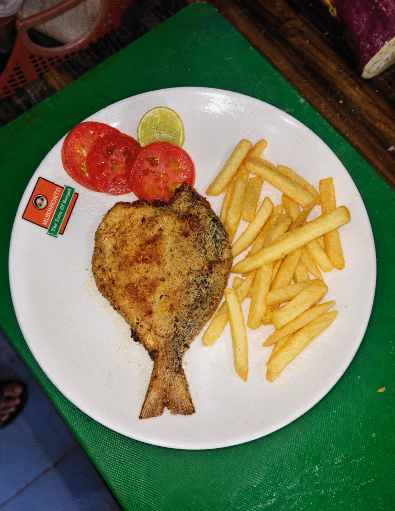 golden fried fish with fries and salad